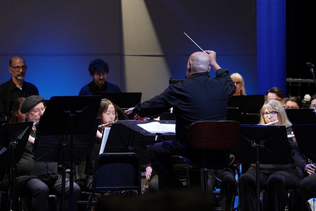Minesh Shah conducting the Ramsey Wind Symphony.